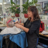 Hair stylist Nancy working